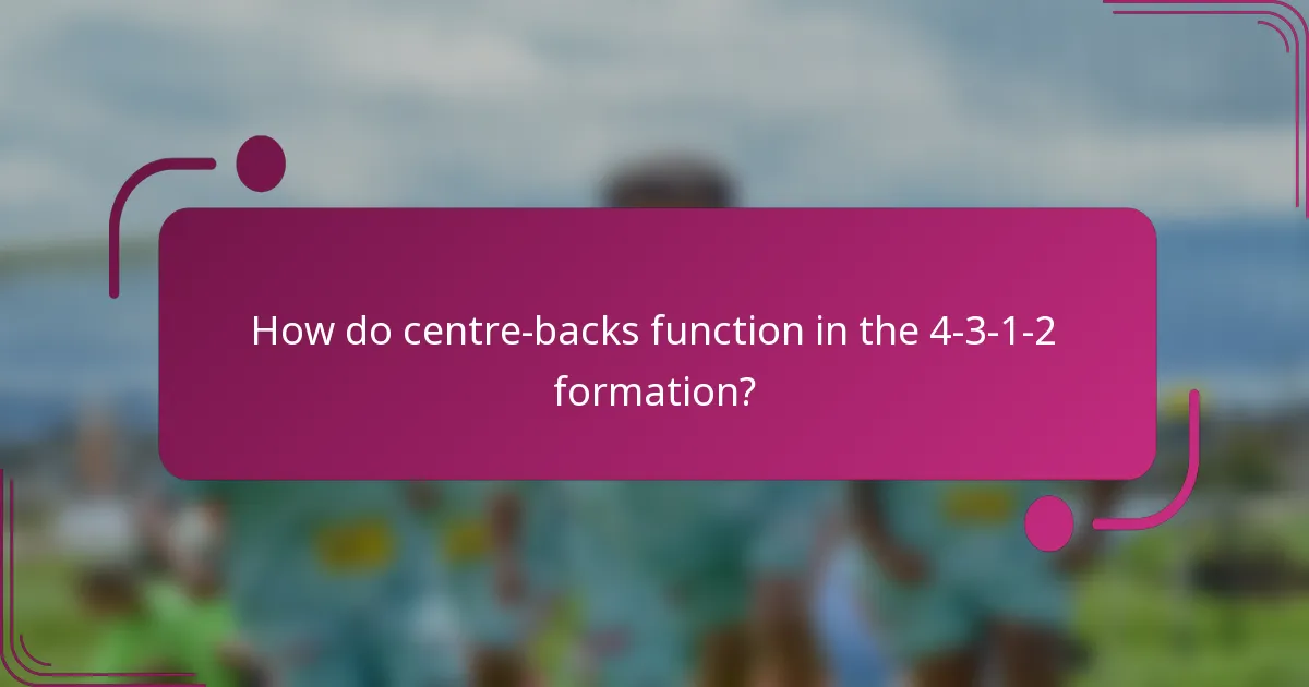 How do centre-backs function in the 4-3-1-2 formation?